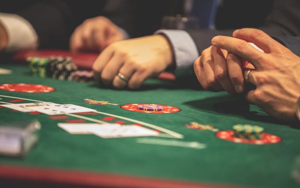 pexels-photo-1871508 person playing poker