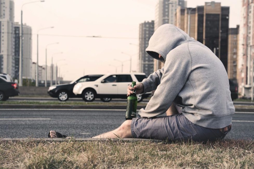 pexels-photo-576494 person in gray hoodie holding beer